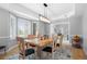 Inviting dining room with natural light, hardwood floors, and views to the entry and outdoors at 920 Shady Oak Ln, Castle Pines, CO 80108