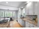 Bright kitchen features granite countertops, stainless steel appliances, and breakfast nook with bright light from the window at 920 Shady Oak Ln, Castle Pines, CO 80108