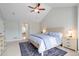 Vaulted main bedroom with neutral paint, ceiling fan, carpet, and ensuite bathroom with soaker tub and shower at 920 Shady Oak Ln, Castle Pines, CO 80108