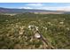 Scenic aerial view of a home and surrounding landscape, highlighting the property's location at 8045 Eagle Rd, Larkspur, CO 80118