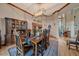 Formal dining area with hardwood floors, decorative lighting, and views to the kitchen at 8045 Eagle Rd, Larkspur, CO 80118