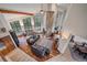 Grand living room featuring soaring ceilings, a stone fireplace, and expansive windows with scenic views at 8045 Eagle Rd, Larkspur, CO 80118