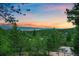 Scenic view of forested landscape with a colorful sunset at 8045 Eagle Rd, Larkspur, CO 80118