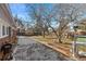 Brick patio with trees and a grill in the backyard at 3433 E Costilla Ave, Centennial, CO 80122