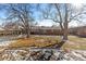 Nice backyard with mature trees and a brick home at 3433 E Costilla Ave, Centennial, CO 80122