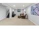 Finished basement with comfortable seating area and large TV at 3433 E Costilla Ave, Centennial, CO 80122