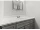 Basement bathroom with gray vanity and white sink at 3433 E Costilla Ave, Centennial, CO 80122