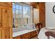 Charming kitchen nook with built-in window seat and storage at 3433 E Costilla Ave, Centennial, CO 80122