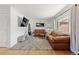 Spacious living room with hardwood floors and leather sofas at 3433 E Costilla Ave, Centennial, CO 80122