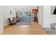 Living room with hardwood floors and built-in shelving at 3433 E Costilla Ave, Centennial, CO 80122