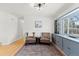 Cozy sitting area with hardwood floors and built-in shelving at 3433 E Costilla Ave, Centennial, CO 80122