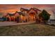 Beautiful home with a stone-accented entryway and a spacious three-car garage at 4337 W Hinsdale Ave, Littleton, CO 80128