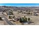 A home nestled in a semi-arid landscape with sparse vegetation and mountain views under a blue sky at 3441 Medallion Rd, Castle Rock, CO 80104