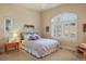 Inviting bedroom features a large window, neutral tones and carpet flooring at 3441 Medallion Rd, Castle Rock, CO 80104