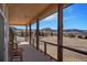 Relaxing covered porch with scenic views of the landscape at 3441 Medallion Rd, Castle Rock, CO 80104