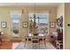 Inviting dining room with picturesque views from windows, a buffet and a charming light fixture at 3441 Medallion Rd, Castle Rock, CO 80104