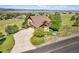 Two-story house featuring a long driveway, three-car garage, and well-maintained landscaping at 3441 Medallion Rd, Castle Rock, CO 80104