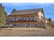 Charming two-story home featuring a spacious walkout porch, landscaped yard, and a serene country setting at 3441 Medallion Rd, Castle Rock, CO 80104