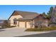 Home featuring an attached three-car garage, side yard access, and partial stone facade at 3441 Medallion Rd, Castle Rock, CO 80104