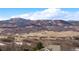 Picturesque landscape view featuring rolling hills and partial view of the home's roof at 3441 Medallion Rd, Castle Rock, CO 80104