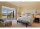 Serene main bedroom with lots of natural light, mountain views, and comfortable seating at 3441 Medallion Rd, Castle Rock, CO 80104