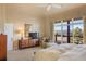 Relaxing main bedroom with views of rolling hills, a spacious area, and natural light at 3441 Medallion Rd, Castle Rock, CO 80104