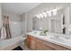 Bathroom featuring double sinks with a shower and tub combination at 10437 W Hampden Ave # 104, Lakewood, CO 80227