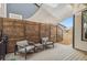 Relaxing backyard deck with shade sail, comfortable seating, and a view of the yard at 5731 Boston Ct, Denver, CO 80238