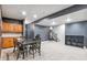 Finished basement features a kitchenette, game area, and home theater at 5731 Boston Ct, Denver, CO 80238