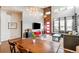 Open dining area with wooden table and bench seating at 5731 Boston Ct, Denver, CO 80238