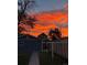 Beautiful backyard view with striking sunset over the homes, creating a serene and vibrant atmosphere at 4452 Zenobia St, Denver, CO 80212