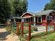 Charming home with a welcoming front yard, low fence, and well-maintained landscaping at 4452 Zenobia St, Denver, CO 80212