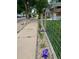 Charming front yard with well-kept landscaping and purple flowers bordering the sidewalk at 4452 Zenobia St, Denver, CO 80212