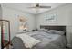 Bedroom with a large bed, neutral tones, and natural light from two windows at 4452 Zenobia St, Denver, CO 80212