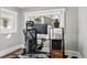Home office with modern desk setup, ergonomic chair, and natural light from a large window at 4452 Zenobia St, Denver, CO 80212