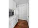 Pantry featuring ample storage with floor to ceiling cabinets and drawers, as well as stylish tile backsplash at 4452 Zenobia St, Denver, CO 80212