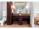 Bathroom featuring dual sinks, recessed lighting, and dark wood cabinets at 5455 Landmark Pl # 903, Greenwood Village, CO 80111