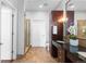 Elegant bathroom featuring double sinks, a glass-enclosed shower, and travertine tile at 5455 Landmark Pl # 903, Greenwood Village, CO 80111