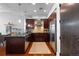 Kitchen space featuring stainless steel appliances, granite countertops, and dark wood cabinetry at 5455 Landmark Pl # 903, Greenwood Village, CO 80111