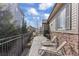 This patio is a perfect spot for relaxation with lounge chairs and a tranquil view of the outdoors at 7790 S Queensburg Way, Aurora, CO 80016