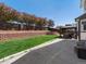 Backyard with stepped retaining wall, green grass and a cozy gazebo on concrete patio is perfect for outdoor living at 13972 Hudson Way, Thornton, CO 80602