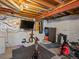 Unfinished basement featuring a television, exercise equipment and workout area at 13972 Hudson Way, Thornton, CO 80602