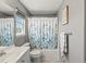 Bathroom featuring vanity, toilet, and tub with a leaf-patterned shower curtain at 13972 Hudson Way, Thornton, CO 80602