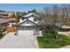 Charming two-story home featuring a spacious two car garage, landscaped front yard and inviting entrance at 13972 Hudson Way, Thornton, CO 80602