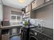 Efficient laundry room equipped with modern appliances and storage solutions for added convenience at 13972 Hudson Way, Thornton, CO 80602