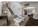 Cozy living room featuring plush seating and staircase at 13972 Hudson Way, Thornton, CO 80602