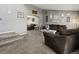 Inviting living room featuring plush seating and staircase at 13972 Hudson Way, Thornton, CO 80602