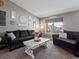 Comfortable living room with plush seating, large windows and an inviting atmosphere at 13972 Hudson Way, Thornton, CO 80602