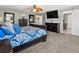 Spacious main bedroom complete with a king bed, dressers, and ensuite bath at 13972 Hudson Way, Thornton, CO 80602