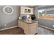 Stylish home office boasts a custom desk with hutch, providing an organized and comfortable workspace at 13972 Hudson Way, Thornton, CO 80602